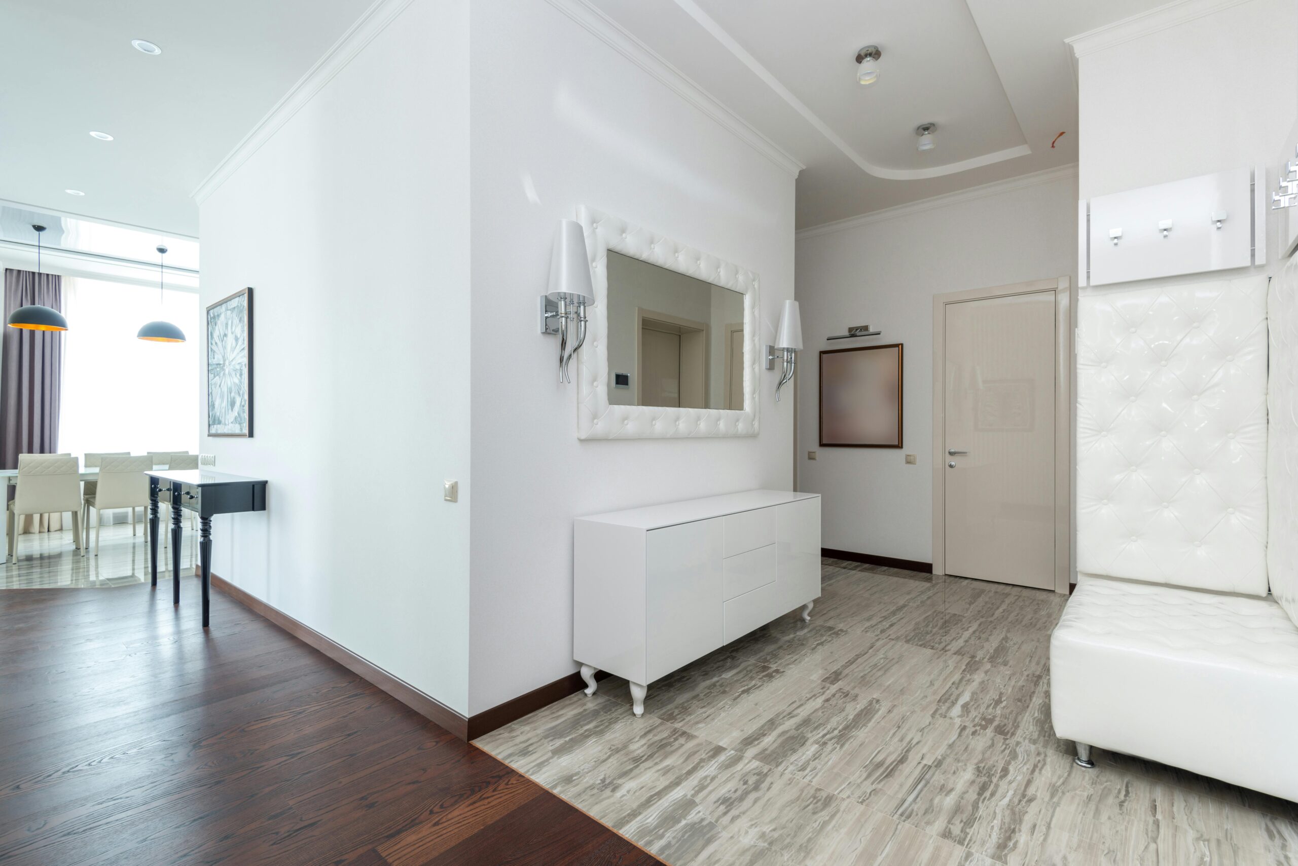 Spacious modern interior with white minimalist decor and luxurious design.